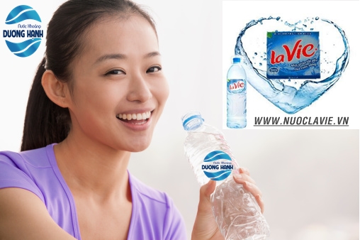 Chinese woman drinking water after exercise